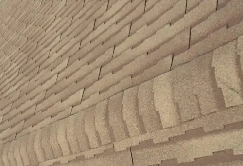Close-up view of overlapping brown asphalt roof shingles arranged in neat, horizontal rows on a Markham home.
