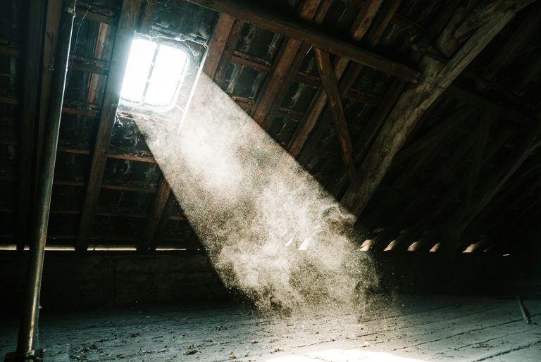 Stream of light coming from a window in the attic