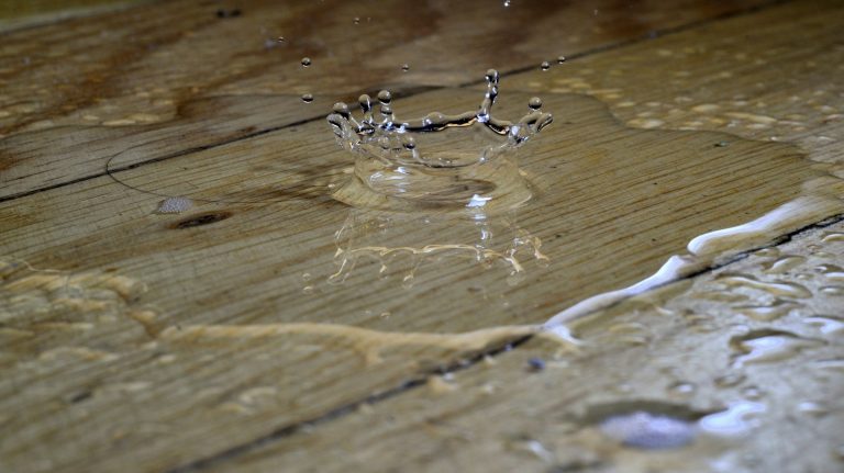 a leak falling on to a wooden floor