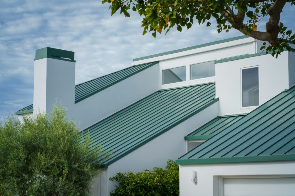 Green metal roof on a modern home