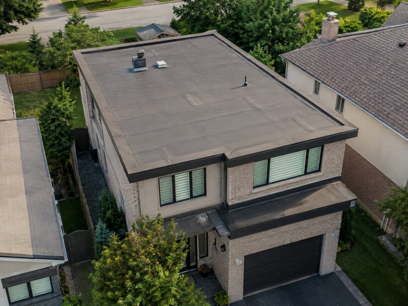 black and gray modern flat roof home from above