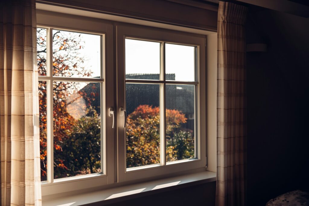 double pane window in a home at dusk